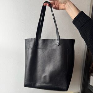 Black leather shoulder bag with adjustable strap